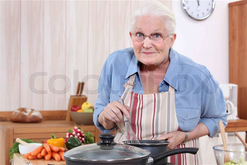 Grandmother cooking, stock photo