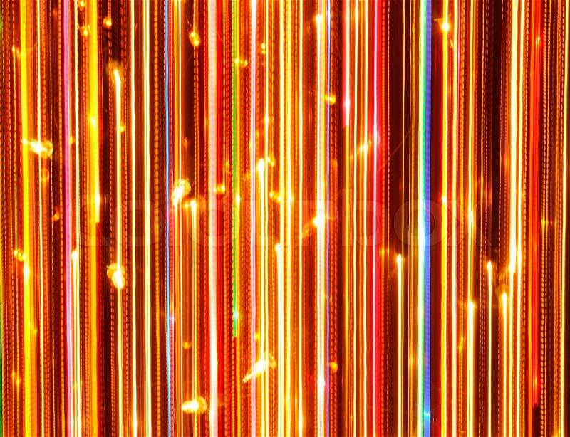 Vertical bright glowing lines against as a background long exposure shot, stock photo