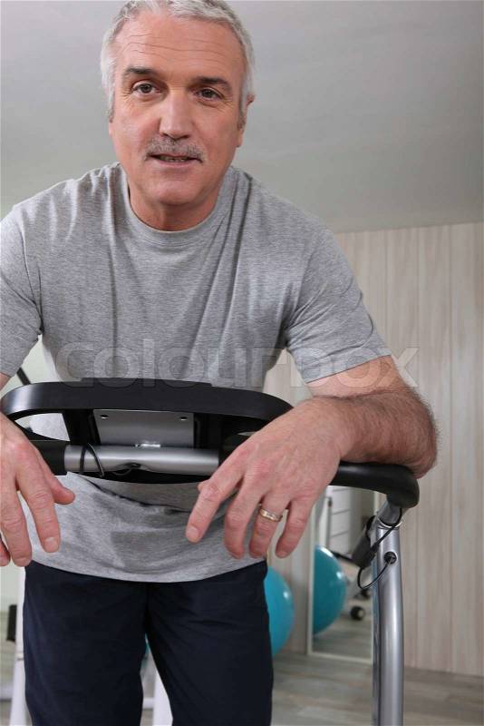 Senior man keeping fit, stock photo