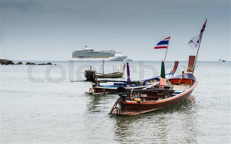 Scenery of andaman sea with long tail boats and a cruise, stock photo