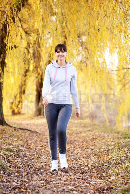 Woman jogging outdoors. Healthy lifestyle, fitness, jogging, active, young concept, stock photo
