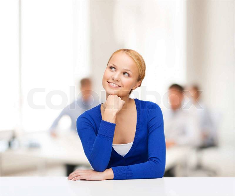 Hapiness and people concept - happy smiling young woman dreaming, stock photo