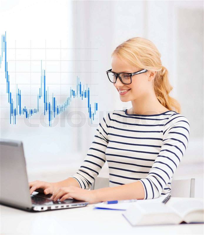 Business, education, money and new technology concept - smiling student with laptop, book, computer, notebook, eyeglasses and forex chart, stock photo