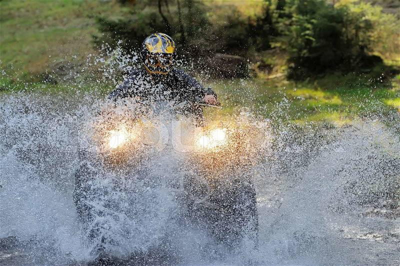 Travel on ATVs in river, stock photo
