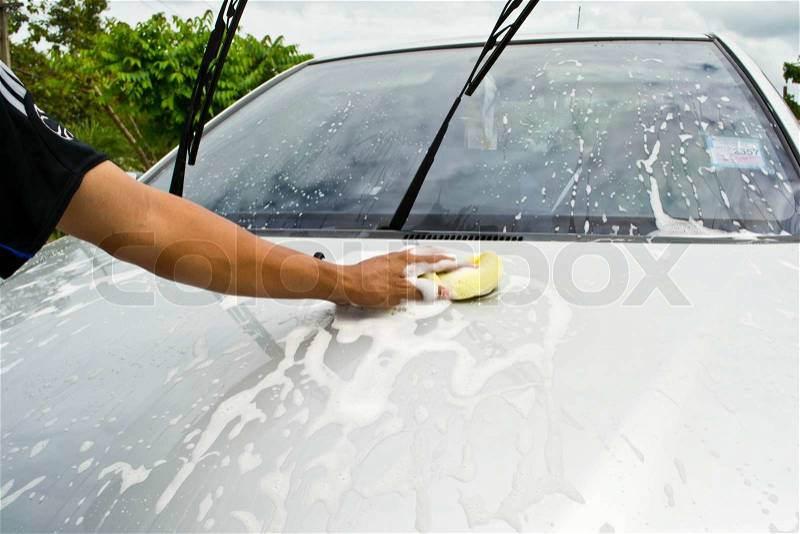 Man and sponge for cleaning car and washing car , stock photo