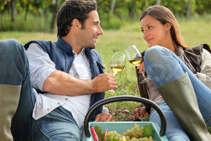 A couple of wine producers toasting, stock photo