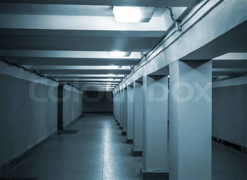 Underground passage with lights and concrete columns , stock photo