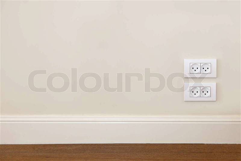 Empty wall with wooden floor and power outlet , stock photo
