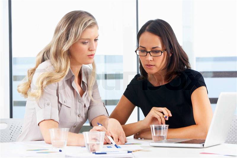 Two Businesswomen Meeting In Office, stock photo