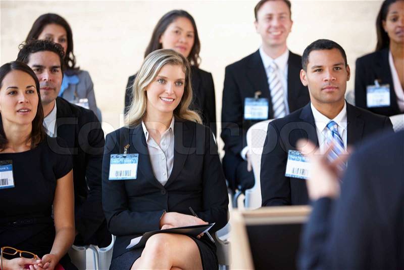 Delegates Listening To Speaker At Conference, stock photo