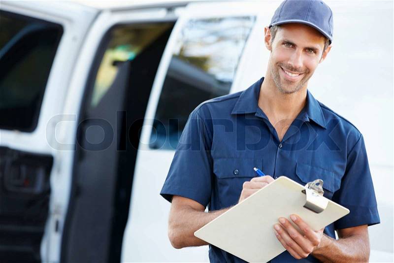 Portrait Of Delivery Driver With Clipboard, stock photo