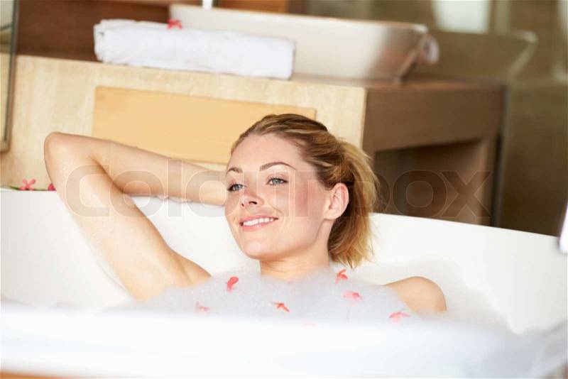 Woman Relaxing In Bubble Bath, stock photo