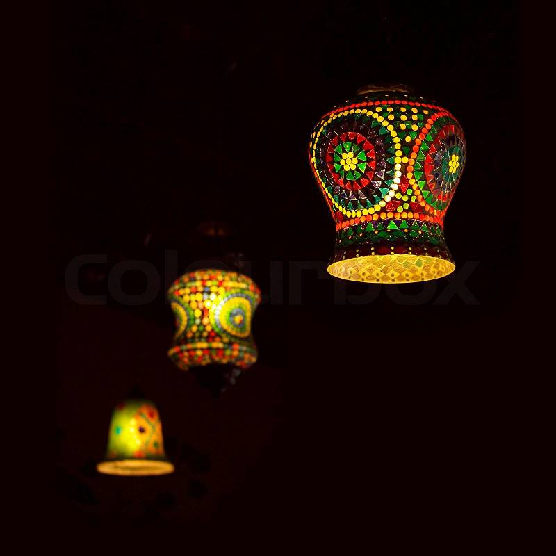 Intricate arabic lamp with lights , stock photo
