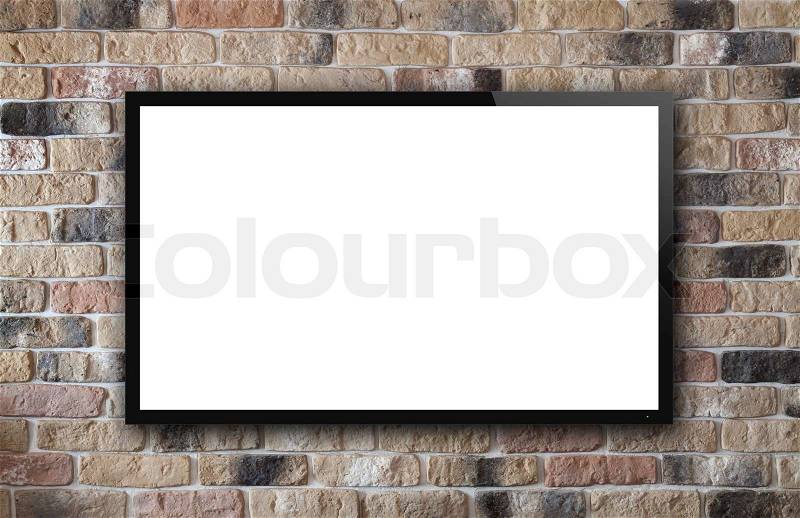 TV display on old brick wall background, stock photo