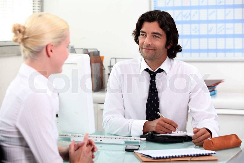 Couple making a date in the diary, stock photo