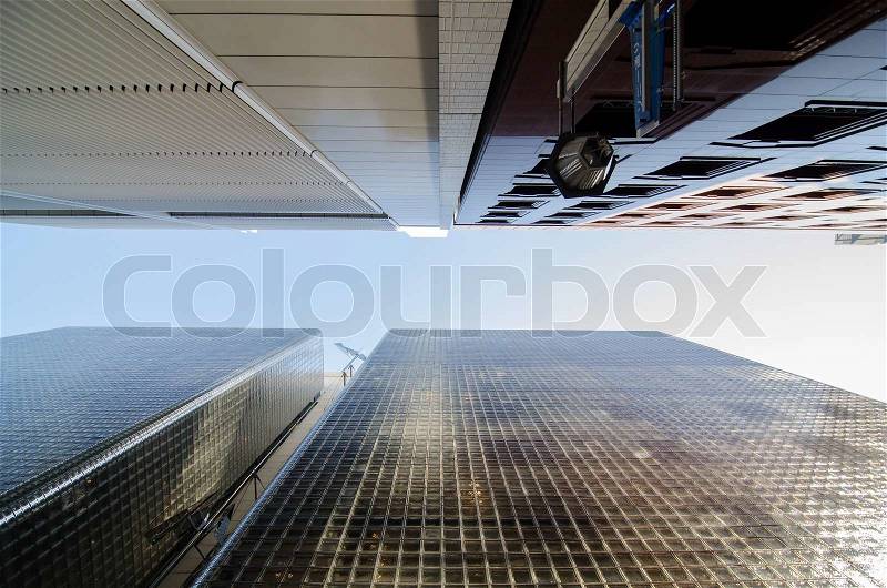 Worm eye view of modern building glass block wall , stock photo