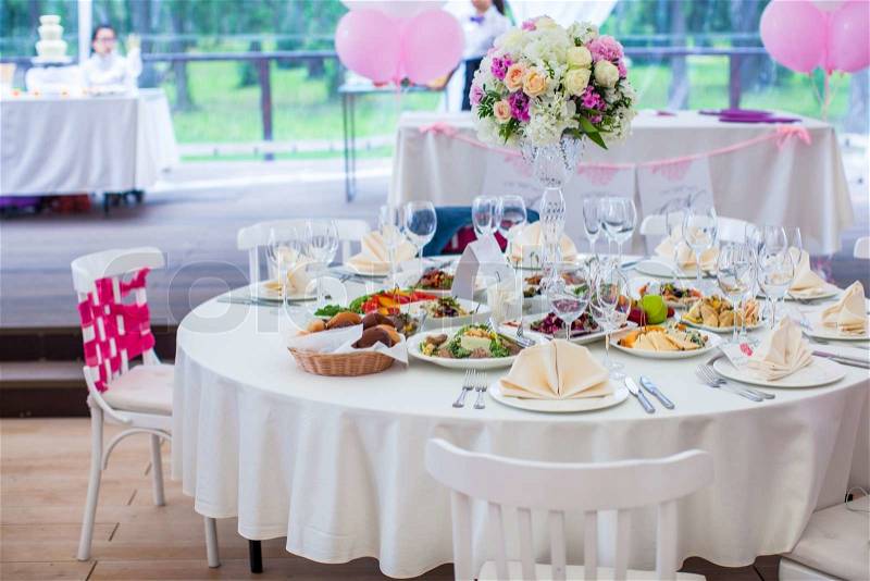 Wedding white banquet tables prepared for wedding celebration, stock photo