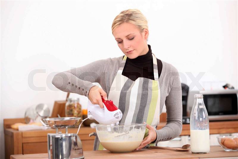 Woman cooking, stock photo