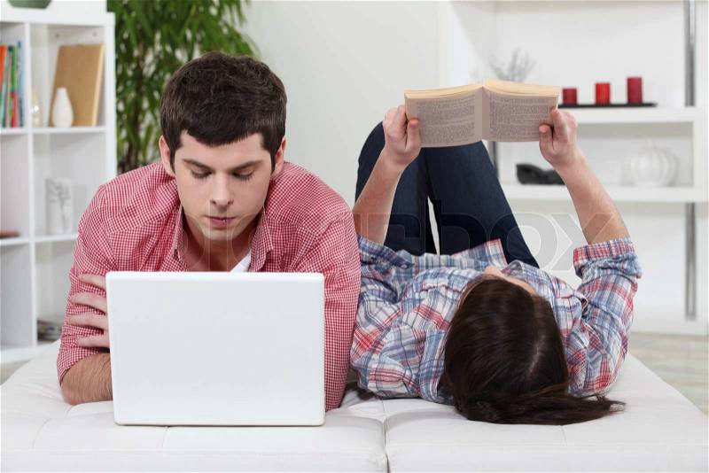 Couple looking at computer, stock photo