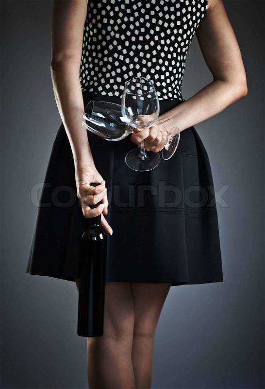 The young woman with wine and two glasses, stock photo