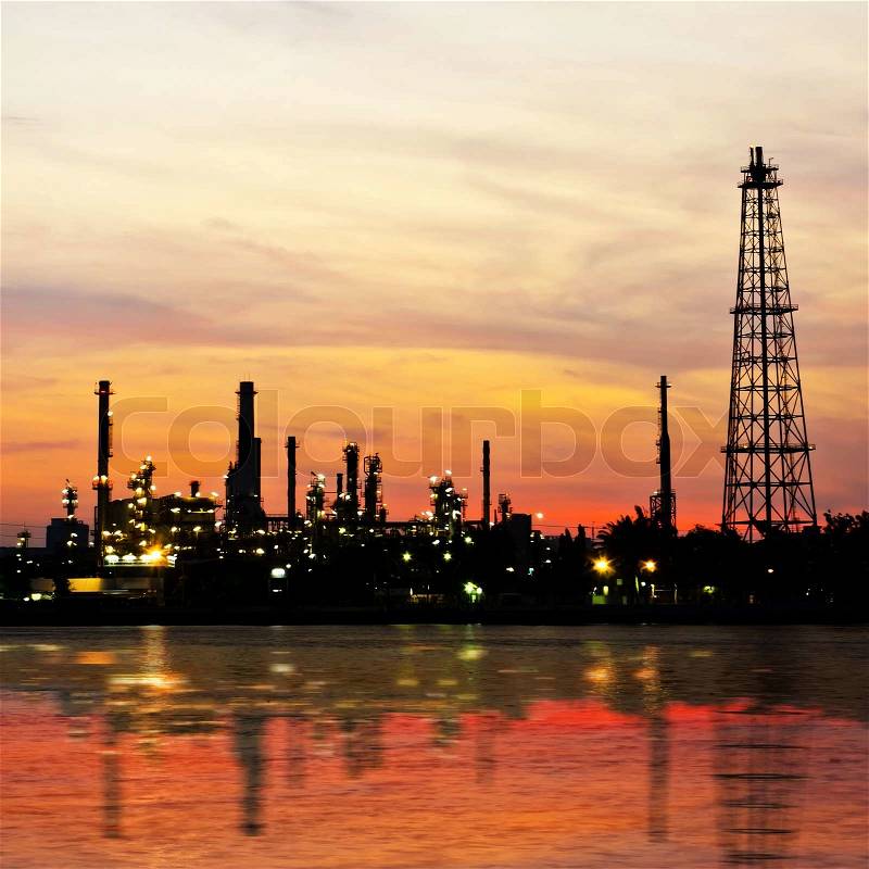 Petroleum oil refinery factory over sunrise in Bangkok, Thailand, stock photo