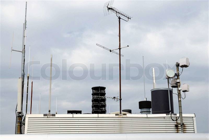 Antennas for cellphone service on building, stock photo