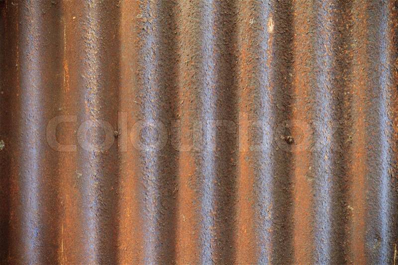 Rusty old corrugated iron fence close up, stock photo