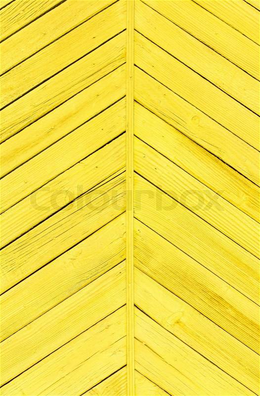 Planks of wood painted bright yellow, stock photo