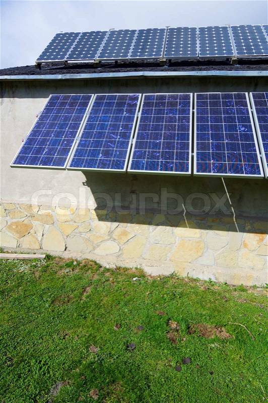 Photovoltaic panels for electric production on the roof of a house, stock photo
