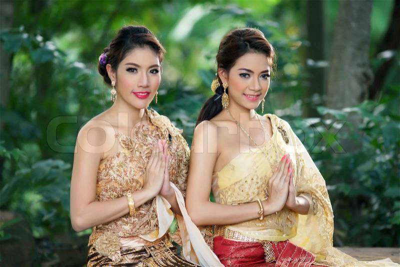 Two Thai woman wearing typical Thai dress, stock photo