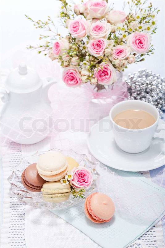 Traditional delicious sweet dessert macarons and coffee on table, stock photo
