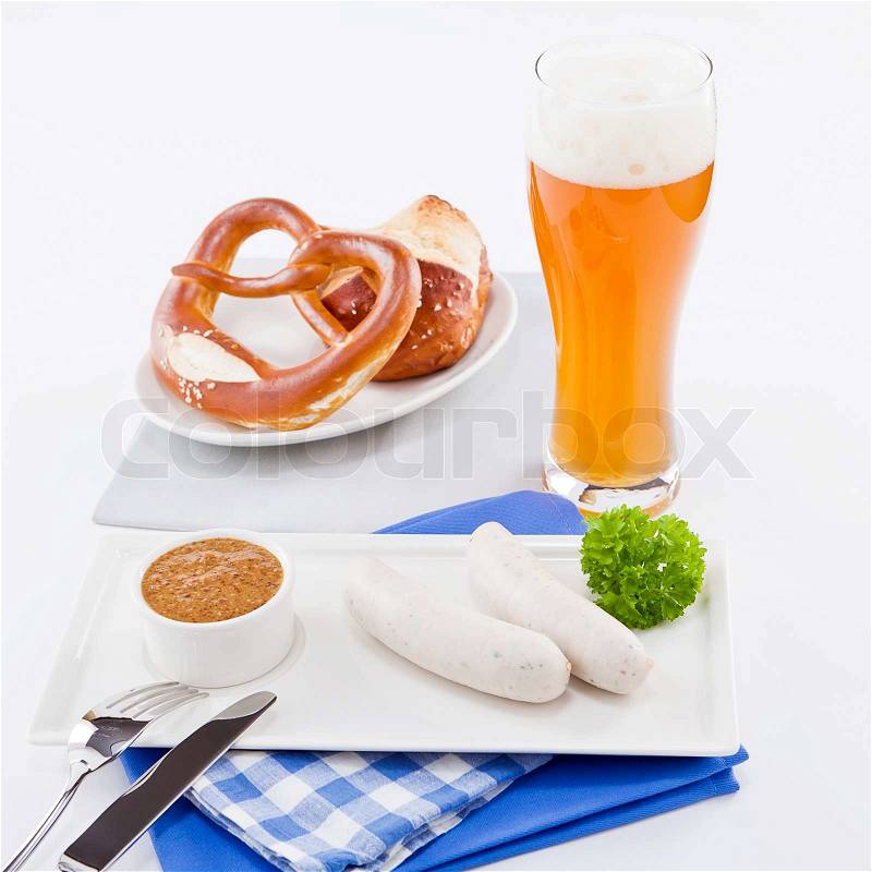 Weisswurst white sausages and sweet mustard with pretzel bavarian traditional food, stock photo