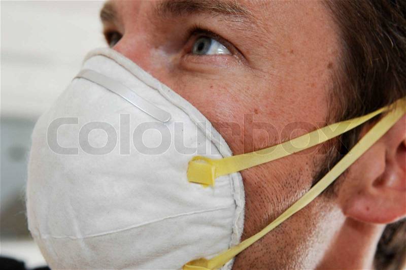 Close-up on man wearing a mouth mask, stock photo