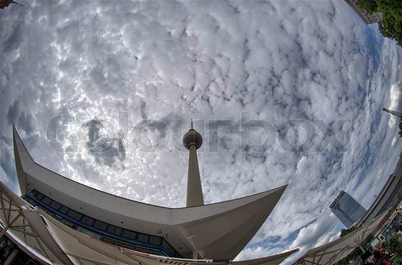 Alexanderplatz, wide angle with with cloudy summer sky - Berlin, Germany, stock photo
