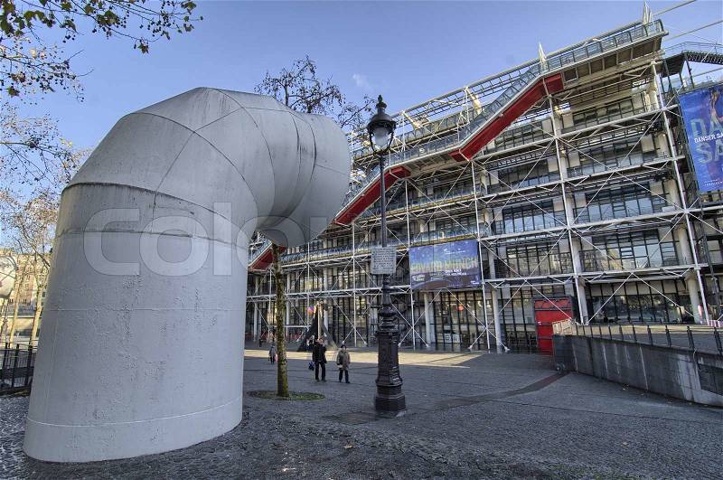 PARIS, NOV 18: People walk in front of Centre Pompidou, November 18, 2011 in Paris. The center is a complex in the Beaubourg area of the 4th arrondissement of Paris, stock photo