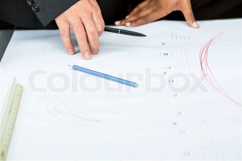 Business people discussing architecture plan sketch in office, stock photo