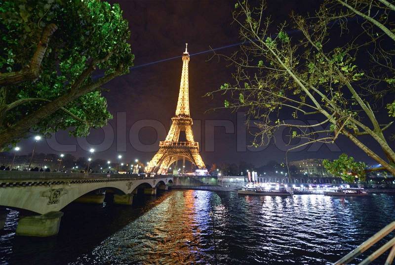 PARIS - DEC 1: Eiffel Tower shows its wonderful lights in the evening, December 1, 2012 in Paris. The Tower is lit by more than 350 lamps mounted within the structure of the tower itself, stock photo