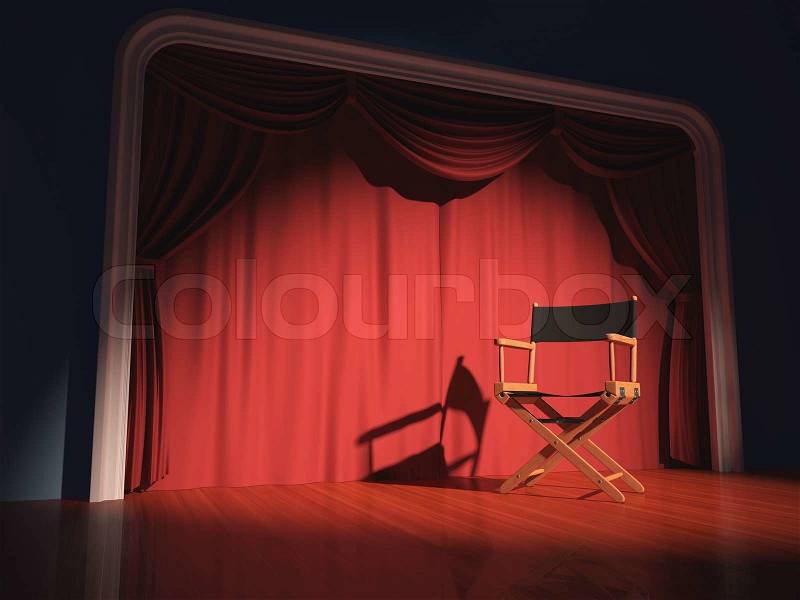 Director\'s chair on the stage illuminated by floodlights, stock photo