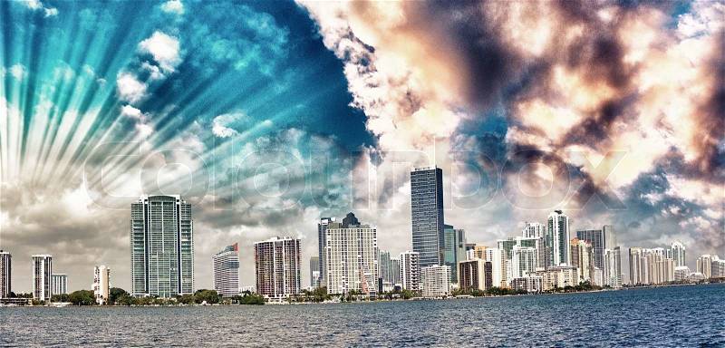 Miami. Wonderful city skyline at sunset. Panoramic view of skyscrapers from the sea, stock photo