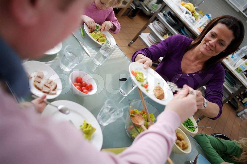 A caucasian family in a dining table, stock photo
