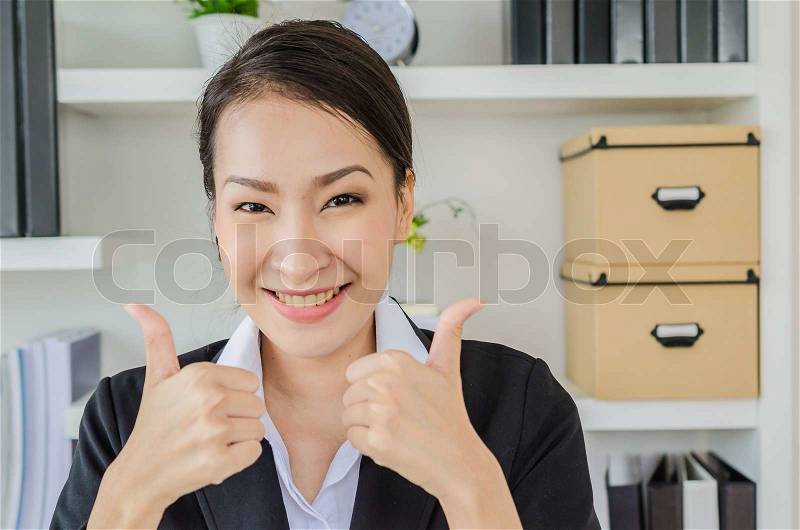 Young business women point finger with smiling, stock photo