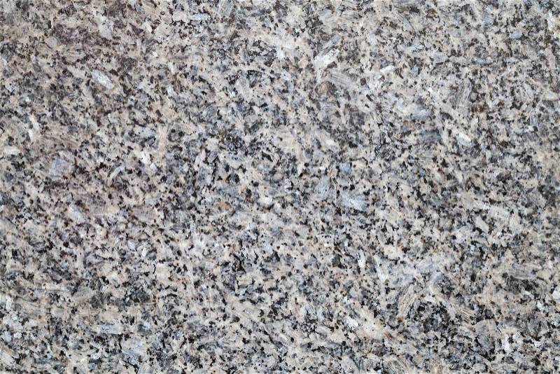 Natural gray granite stone closeup background texture, stock photo