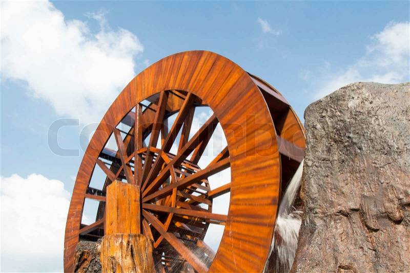 Water wheel turbine. The use falling water to create power .Thailand, stock photo