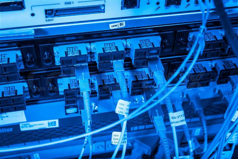 Server with fiber optic cables in data center, stock photo
