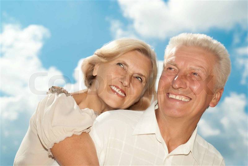 Beautiful elderly couple went for a walk on spring day, stock photo