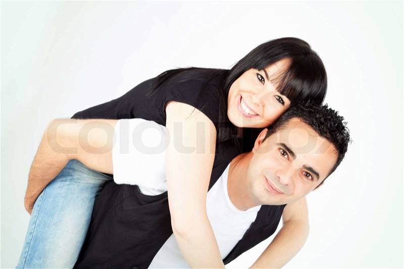 Happy couple piggyback together, stock photo