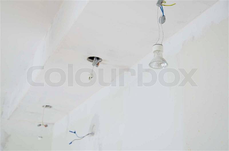 Undone halogen light bulbs on electric wires, stock photo