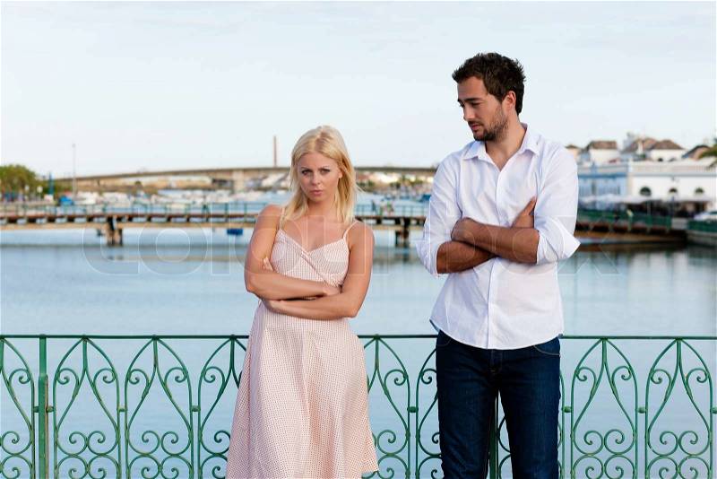 Couple having a discussion in summer in their vacation, stock photo