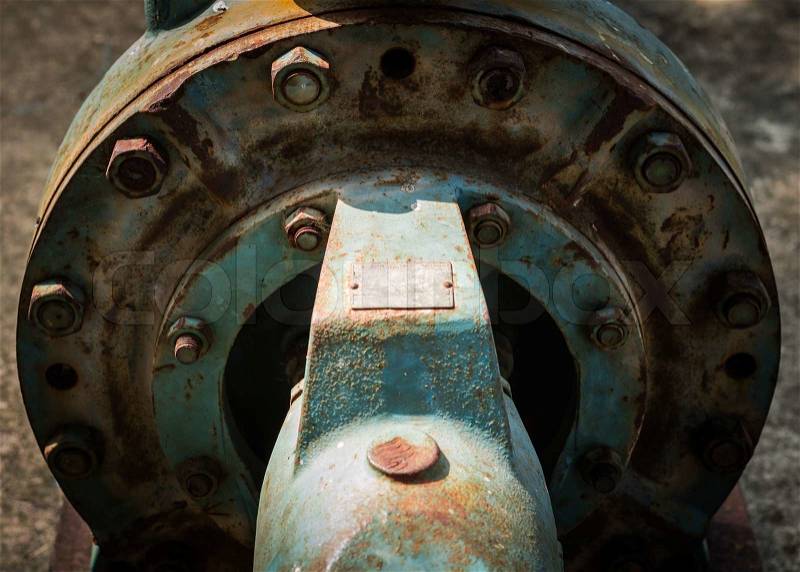 Close up old rust water pump under sunlight, stock photo