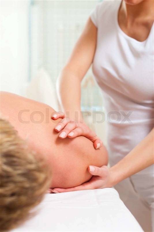 Patient at the physiotherapy gets massage or lymphatic drainage, stock photo